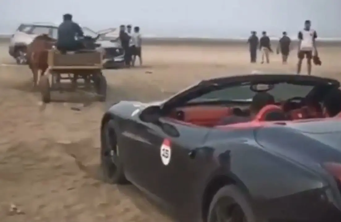 Ferrari California T pulled out of sand by a bullock cart at Revdanda Beach | Photo: Screengrba of X / @lordujjwal7