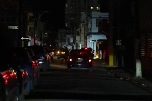 A street is dark during a blackout in San Juan. | AP