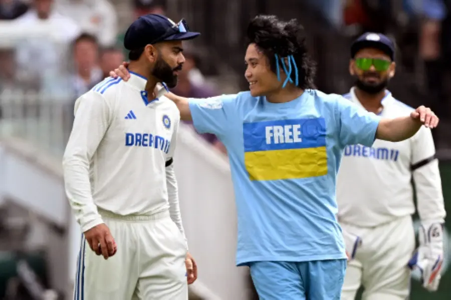 Pitch invader with 'Free Ukraine' slogan on T-shirt tries to hug Kohli as Rohit watches | VIDEO