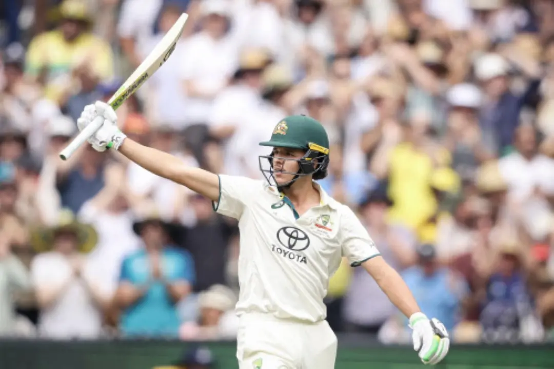 Sam Konstas raises his bat after passing 50 runs on day one of the fourth cricket Test match between Australia and India at the Melbourne Cricket Ground (MCG) in Melbourne. | Photo: AFP
