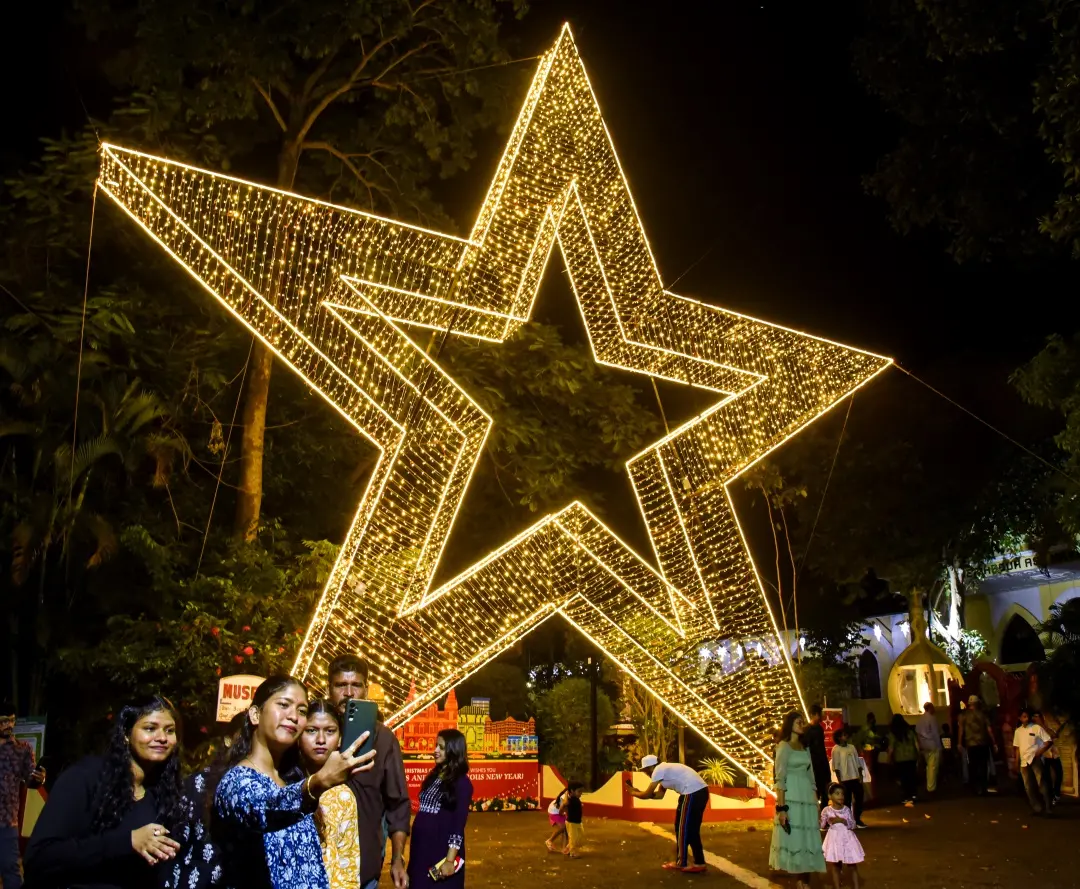 People visit Bishop's House where a giant star has been installed on Christmas eve in Kochi | Photo: PTI