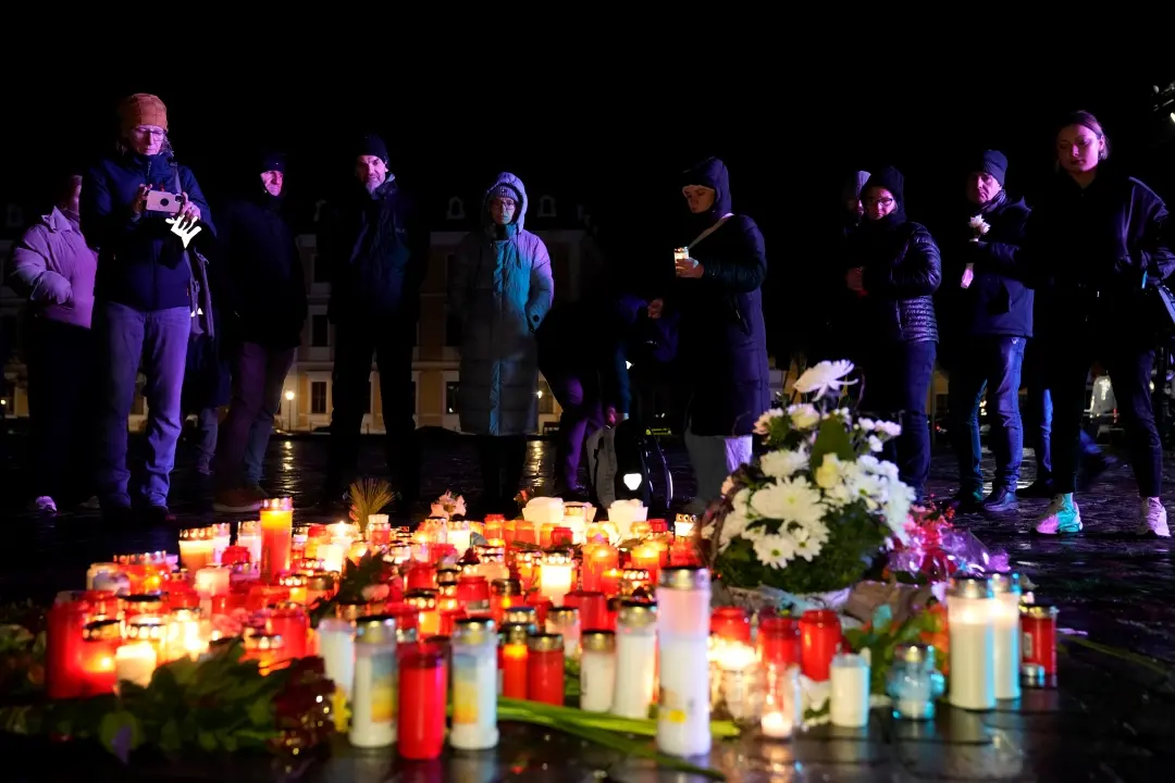 People light candles outside Magdeburg Cathedral after a memorial service for victims of Friday's Christmas Market attack | Photo: AP