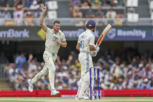 Australia's Josh Hazlewood, left, celebrates the wicket of India's Virat Kohli, right, during play on day three of the third cricket test between India and Australia at the Gabba in Brisbane, Australia | Photo: AP