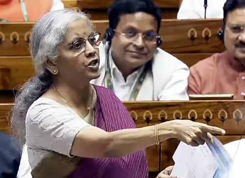 Union Minister of Finance and Corporate Affairs Nirmala Sitharaman speaks in the Lok Sabha during the Monsoon Session of Parliament, in New Delhi on Tuesday. | Photo: ANI