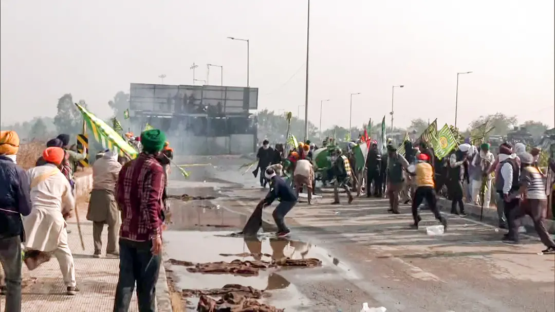 Police personnel use tear gas and water cannon to disperse the farmers protesting over various demands at Haryana-Punjab Shambhu Border | Photo: ANI