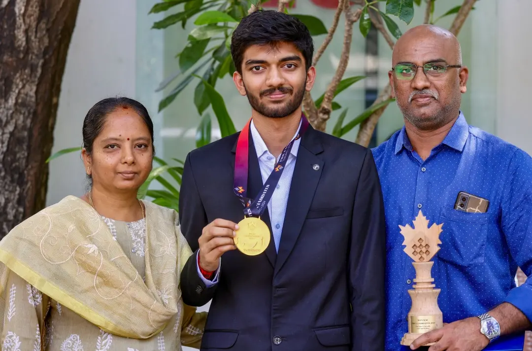 Gukesh with his parents