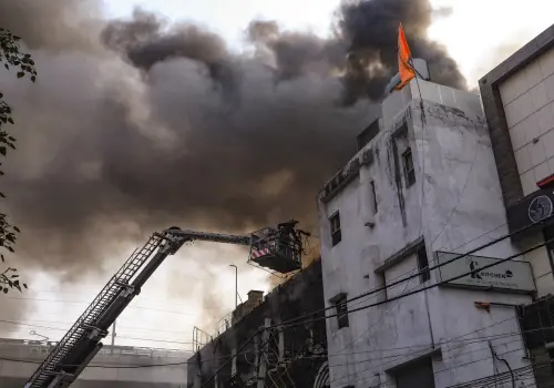 Firefighters try to douse a fire that broke out in a restaurant near Rajouri Garden metro station, in New Delhi, Monday | Photo: PTI