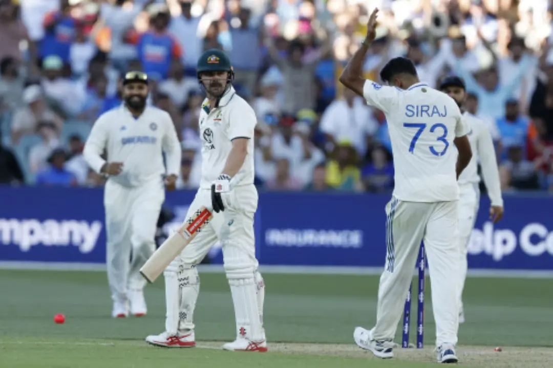 Mohammed Siraj, right, celebrates after the dismissal of Australia's Travis Head, centre, during the day two of the second cricket test match between Australia and India at the Adelaide Oval. | Photo: AP/PTI