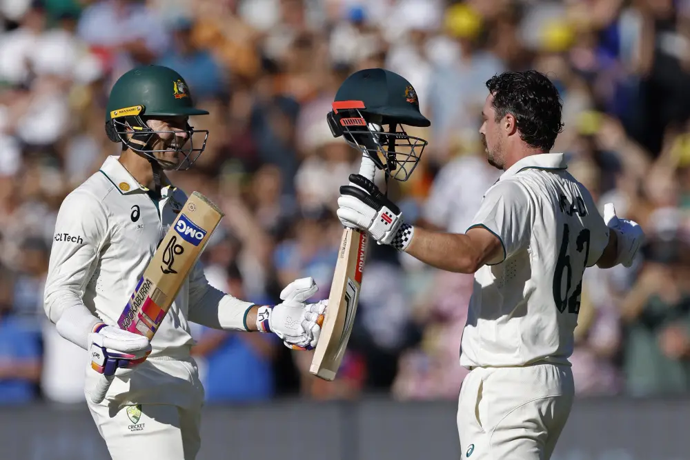 Travis Head, right, celebrates with teammate Alex Carey after scoring a century | AP