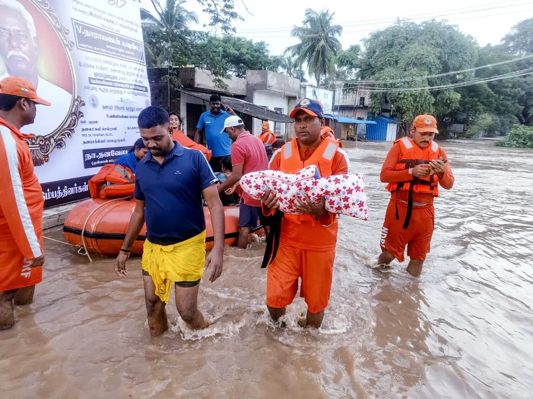 National Disaster Response Force (NDRF) personnel rescue an infant from a flooded area following heavy rainfall triggered by Cyclone Fengal, in Puducherry | File Photo: ANI