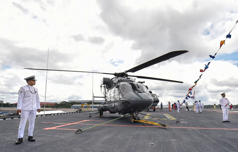 Navy personnel near an advanced light helicopter (ALH) | PTI