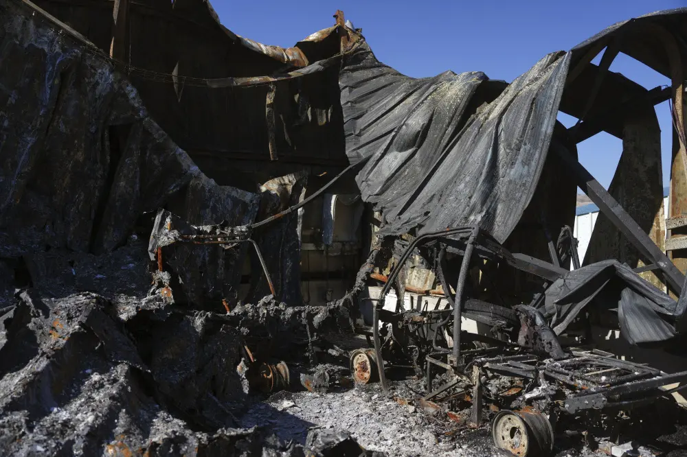 Burned-out cars and buildings from Hezbollah rockets are seen in the agricultural settlement of Avivim, near the Lebanese border in the Upper Galilee, Israel | AP