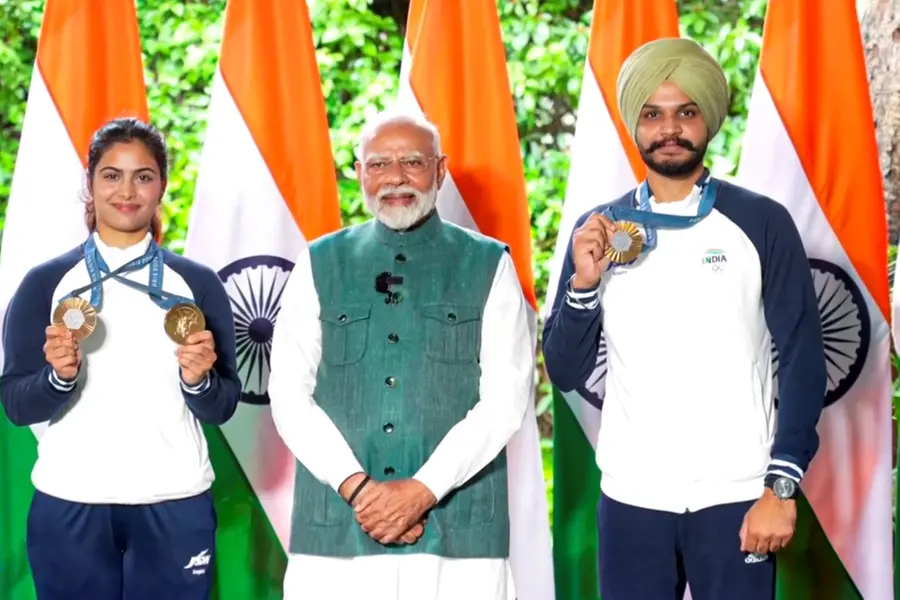 PM Modi meets Olympic medalists; Bhaker demonstrates pistol, hockey team gifts signed stick