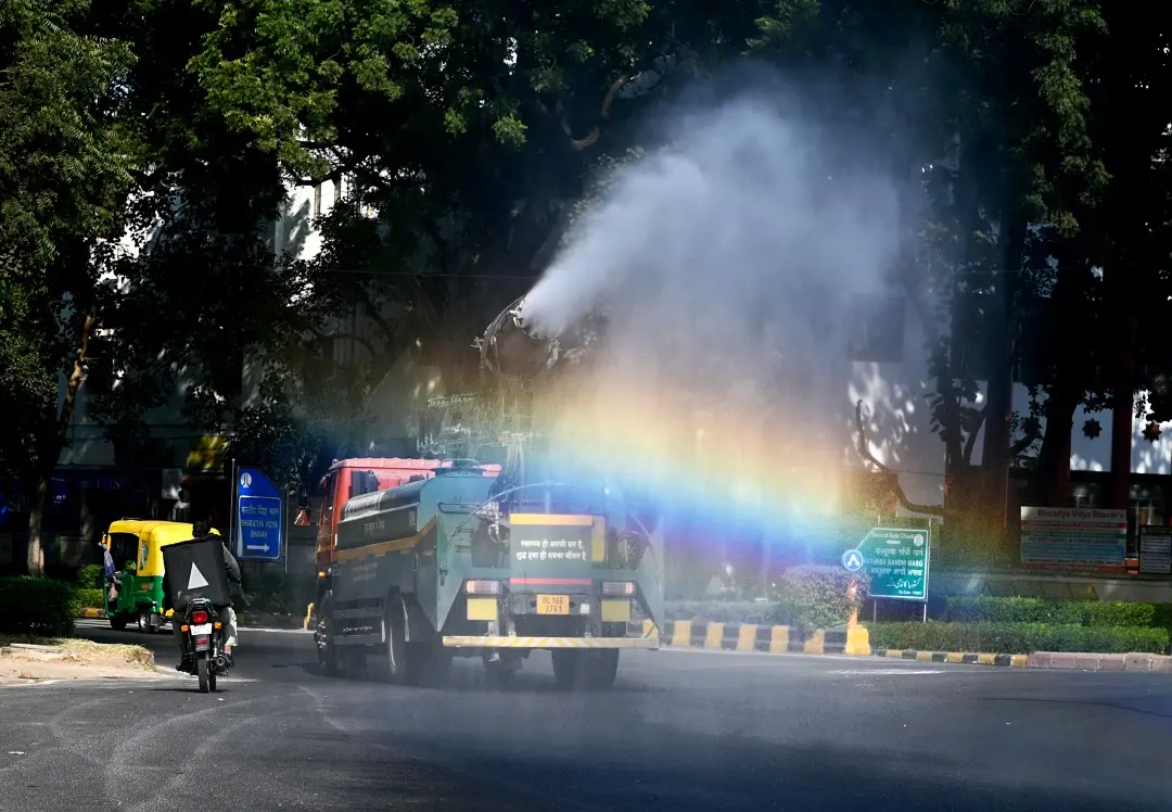 An anti-smog gun sprays water droplets to curb air pollution