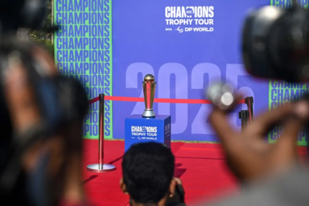 Cameraman take visuals of the winning trophy during 'ICC Champions Trophy' tour at the National Stadium in Karachi. | File Photo: AFP