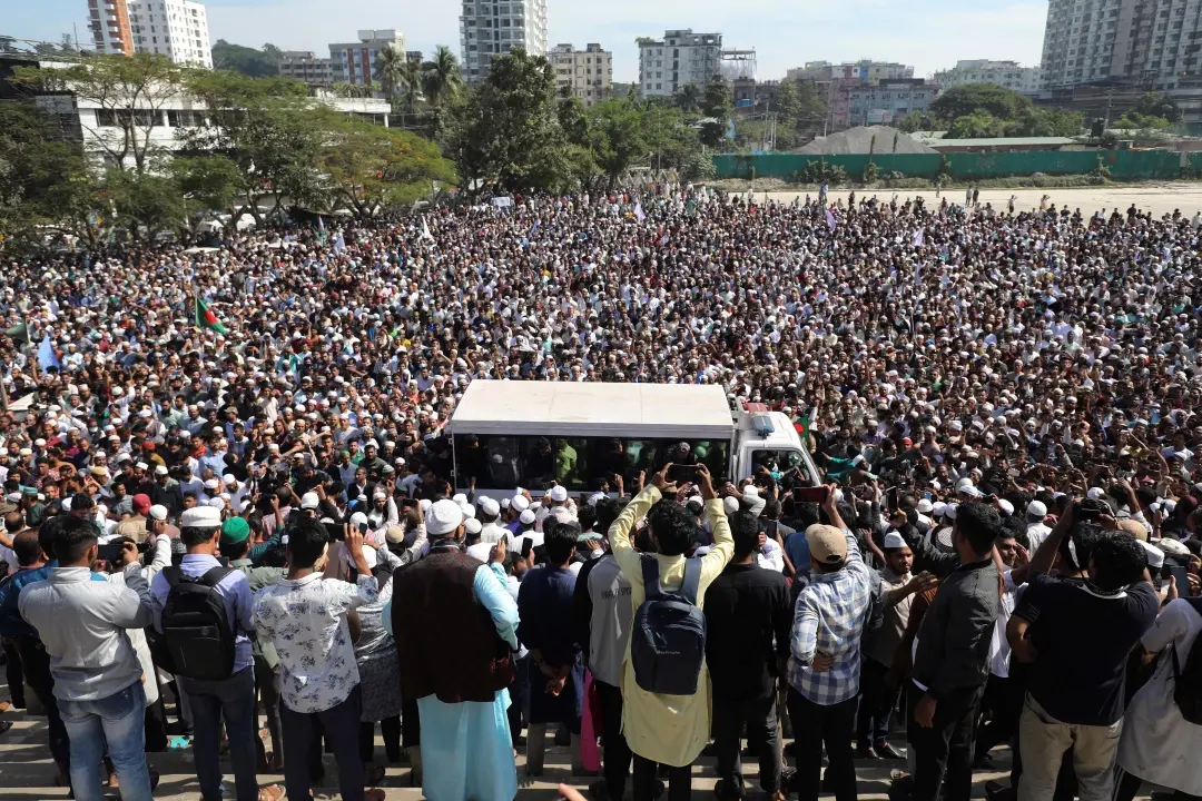 People participate in the funeral of a lawyer killed on Wednesday in a daylong violence over the arrest of a prominent minority leader at the court premises, in Chattogram in southeastern Bangladesh