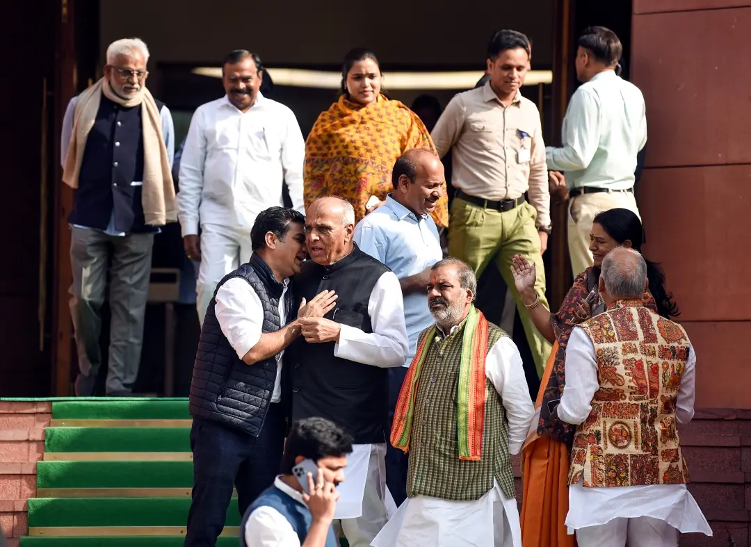 Congress MP Hibi Eden interacts with BJP MP and Waqf Amendment Bill JPC chairman Jagdambika Pal at Parliament House during the Winter Session in New Delhi on Wednesday