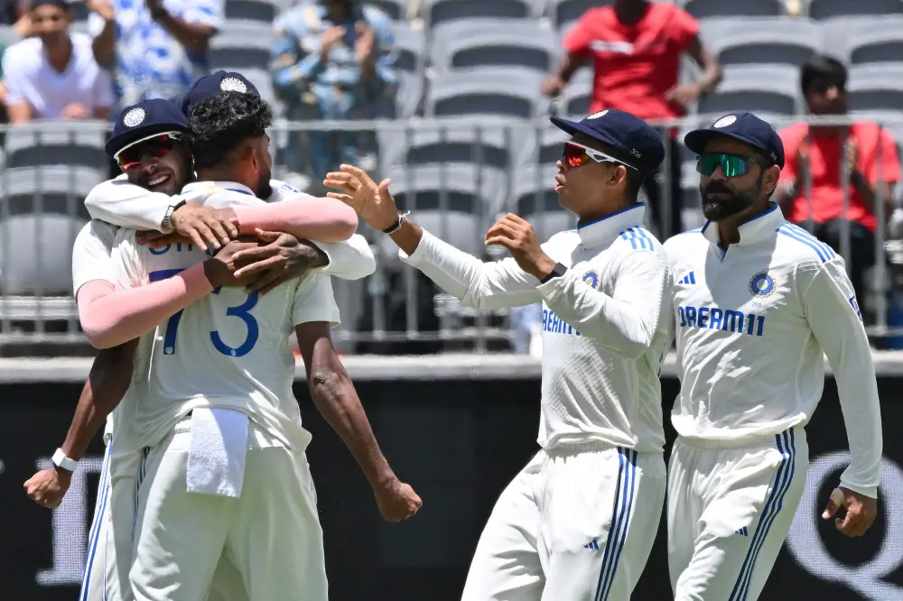 Mohammed Siraj (L) celebrates the wicket of Australia's Steve Smith with teammates | AFP