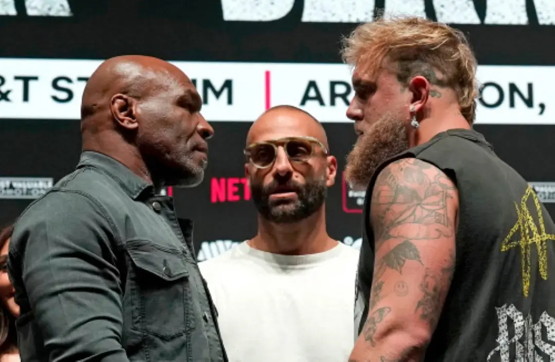 US boxer Mike Tyson (L) and US boxer-actor Jake Paul (R) face each other during a press conference ahead of their heavyweight bout at The Pavilion at Toyota Music Factory in Irving, Texas. | Photo: AFP
