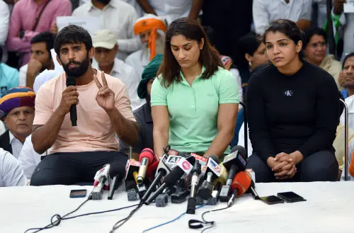 Wrestlers Bajrang Punia, Vinesh Phogat and Sakshi Malik speak to the media | ANI