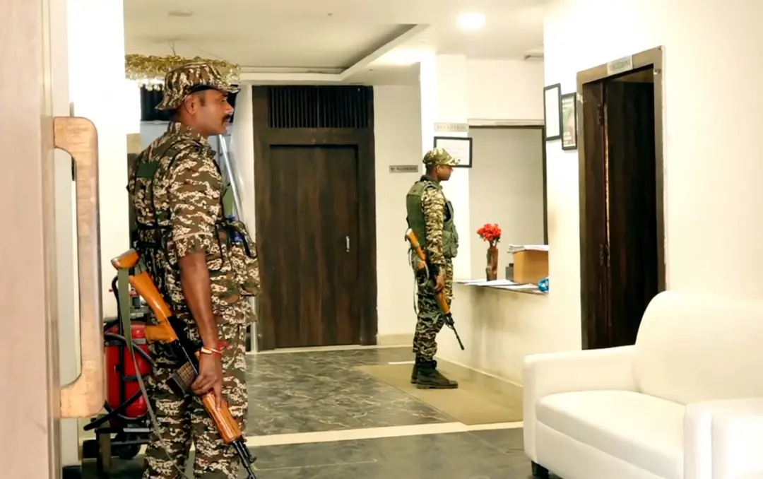 Security personnel stand guard at Mountain View Resort during a raid by the Enforcement Directorate in connection with a money laundering investigation linked to alleged illegal infiltration of Bangladeshi nationals, in Ranchi on Tuesday