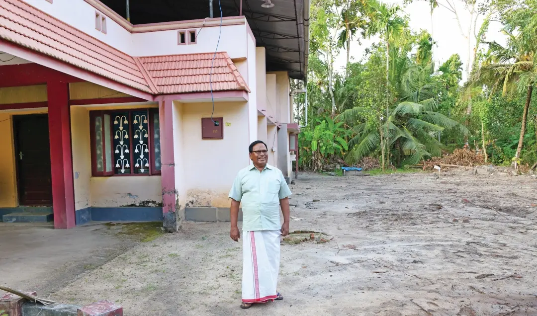 N Surendran next to the house and property donated to Gandhibhavan