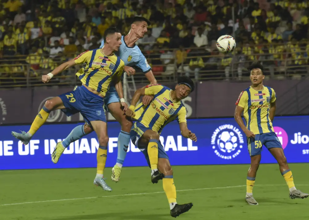 Players of Kerala Blasters FC ( Yellow) and Hyderabad FC vie for the ball during an Indian Super League (ISL) 2024-25 season football match | PTI