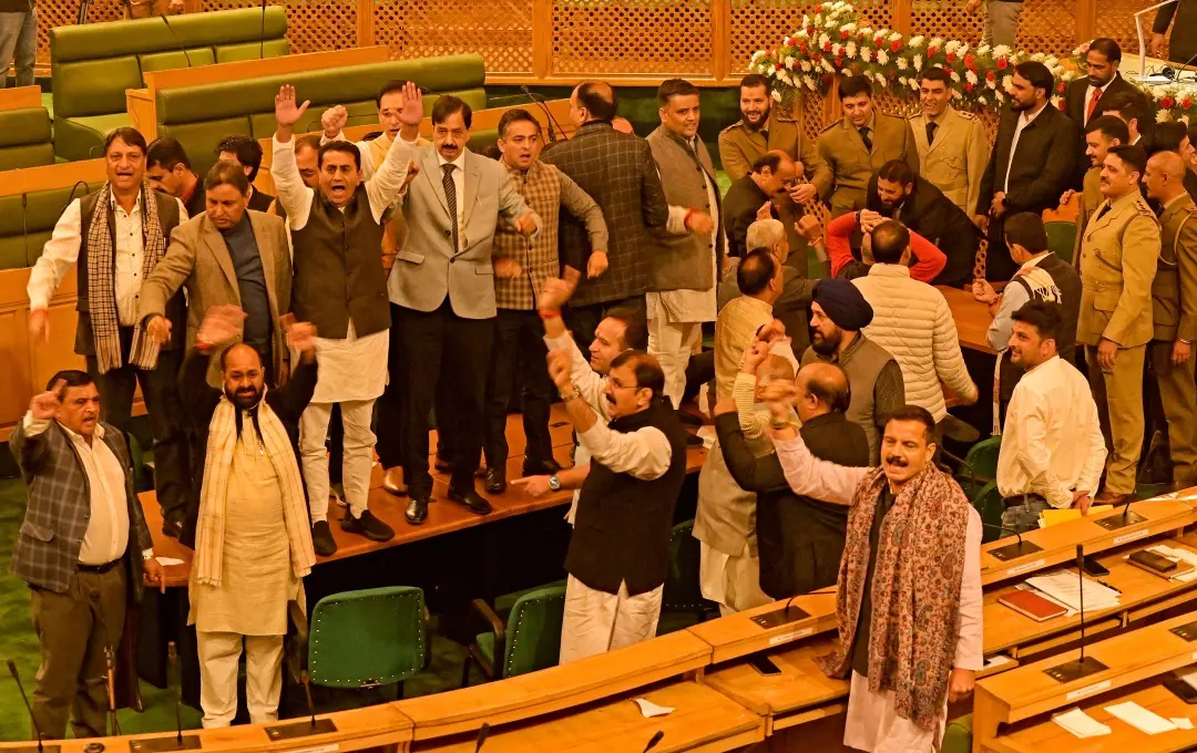 Bhartiya Janta Party (BJP) shout slogans against a resolution to restore special status for India's Jammu and Kashmir state, during a legislative assembly in Srinagar