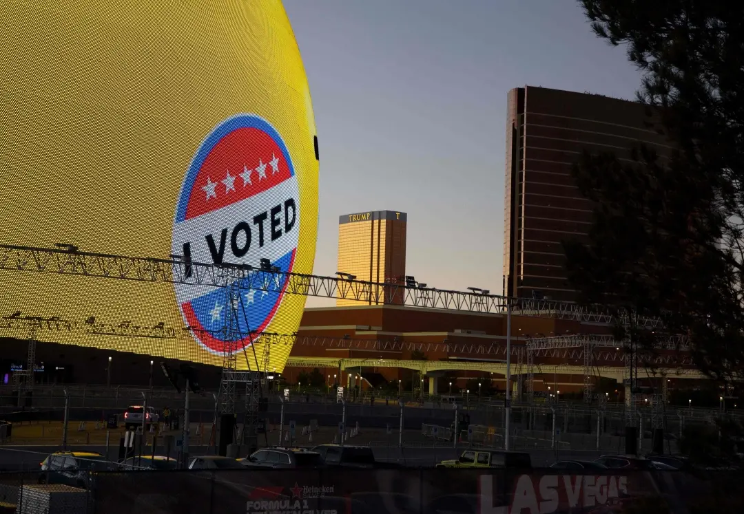 Trump International hotel is seen in the background of the Sphere, entertainment arena, displaying an 'I Voted' election-theme sign in Las Vegas, Nevada | Photo: AFP