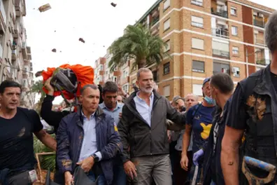 Crowd throws mud at Spanish king during visit to flood-stricken town