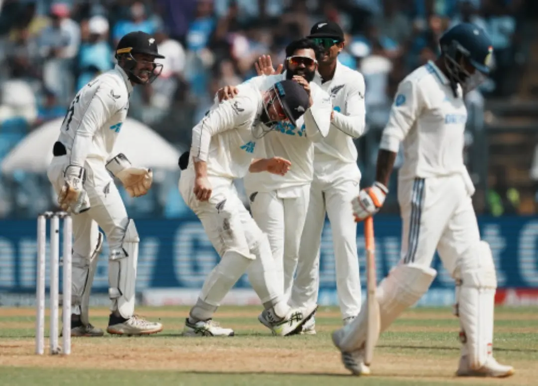 Ajaz Patel with teammates celebrates the wicket of India's Ravindra Jadeja during day three of third Test cricket match between India and New Zealand at Wankhede Stadium in Mumbai. | Photo: PTI