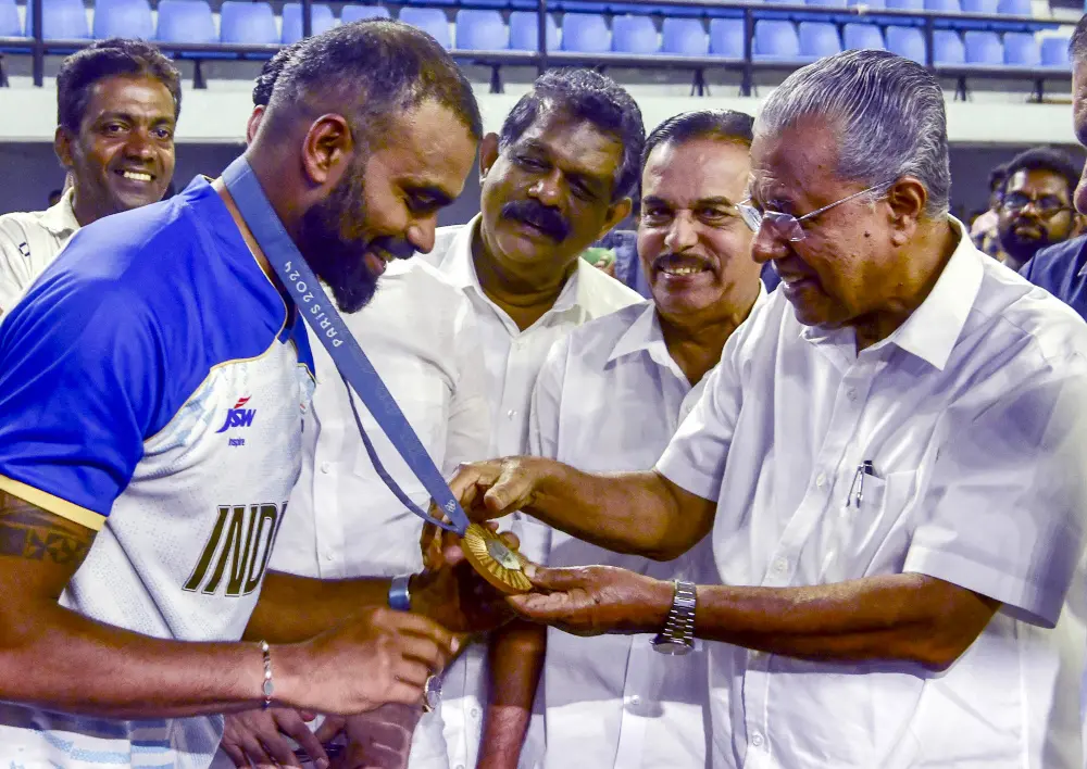 Pinarayi Vijayan with Olympian hockey player PR Sreejesh | PTI