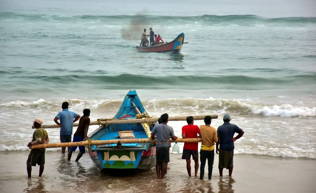 Fishermen shift their boats in preparations for Cyclone Dana in Puri | Photo: PTI