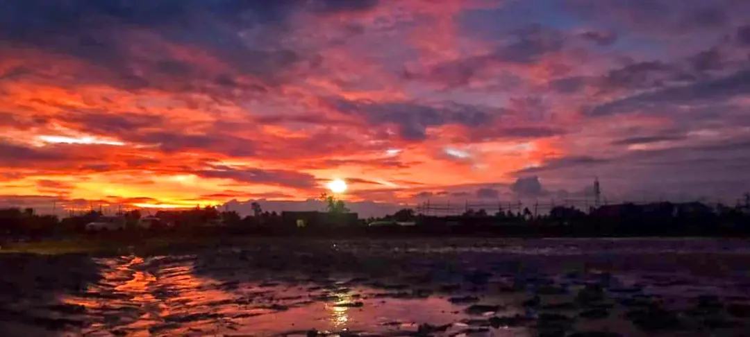 The sun sets at Dhamra port, before the landfall of cyclone 'Dana', in Bhadrak district, Odisha on Wednesday | Photo: PTI