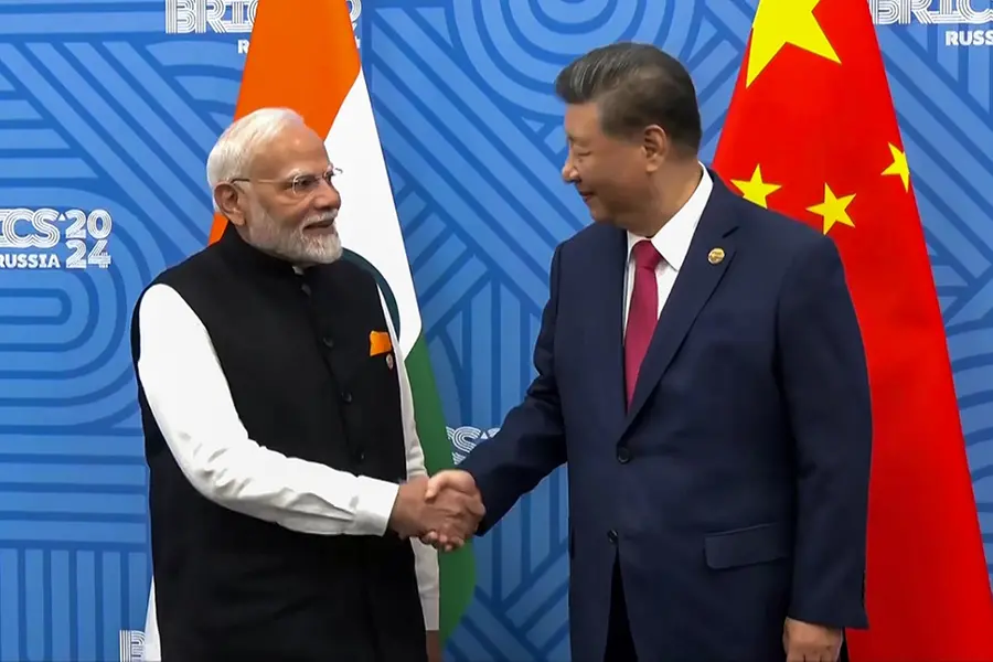 What did India and China discuss during their crucial bilateral meeting at the BRICS Summit?