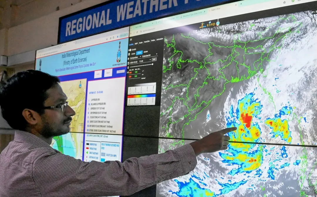 Scientist Sourish Bandopadhyay shows the progress of cyclonic storm 'Dana' on a digital screen, at the regional meteorogical centre in Kolkata on Tuesday | Photo: PTI