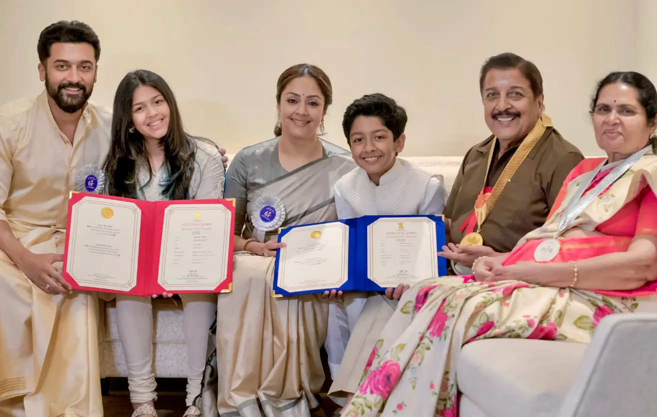 Suriya with his daughter Diya, wife Jyotika, son Dev, father Sivakumar and mother Lakshmi. Photo: twitter/Suriya Sivakumar