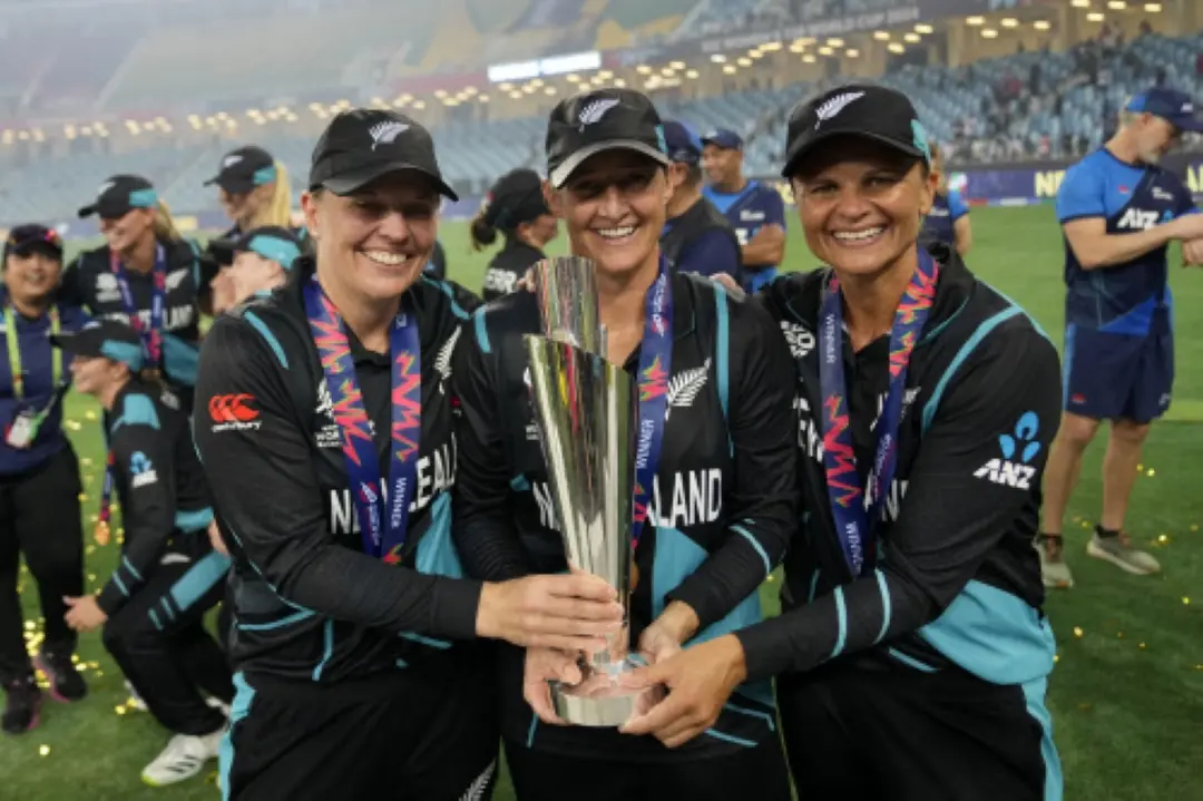 New Zealand's captain Sophie Devine, center, poses with teammates Lea Tahuhu, left, and Suzie Bates with the trophy after winning the ICC Women's T20 World Cup 2024 final match against South Africa at Dubai International Cricket Stadium in UAE. | Photo: AP