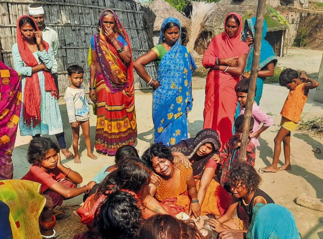 People being treated after the consumption of suspected spurious liquor, in Saran