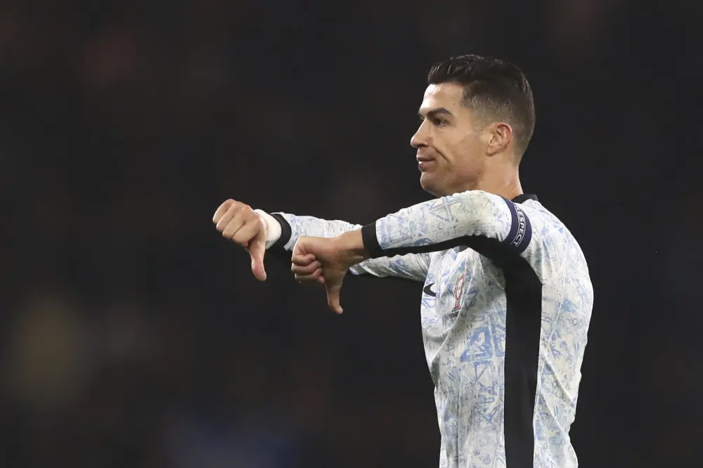 Cristiano Ronaldo reacts during the UEFA Nations League soccer match between Scotland and Portugal | AP