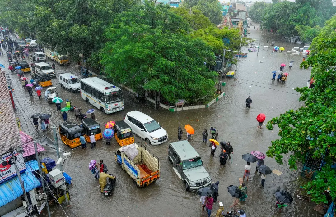 ehicles ply on waterlogged roads amid rains in Chennai | Photo: PTI