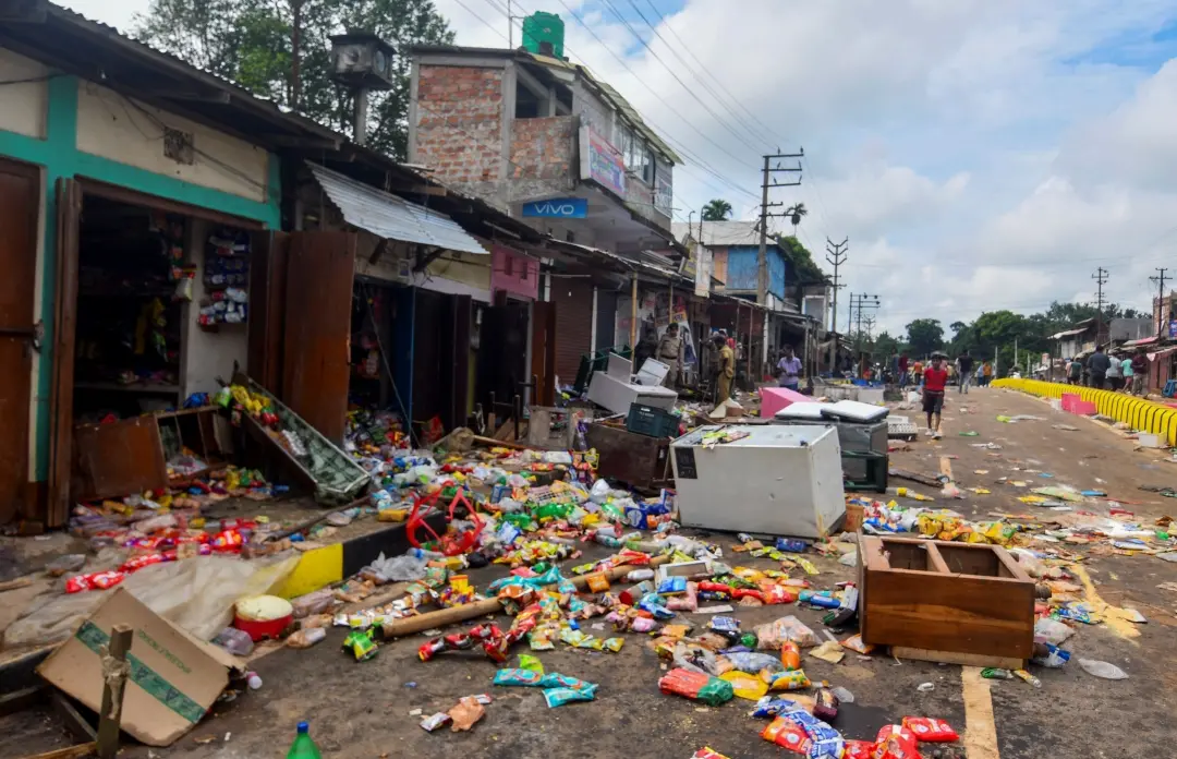 Goods strewn outside vandalised shops after clashes between two communities, at Kadamtala | File photo: PTI