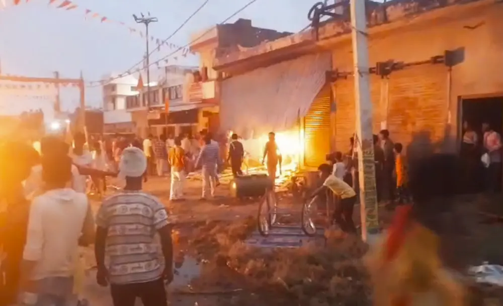 People set fire to two-wheelers after a youth died of a gunshot wound during a religious procession | PTI