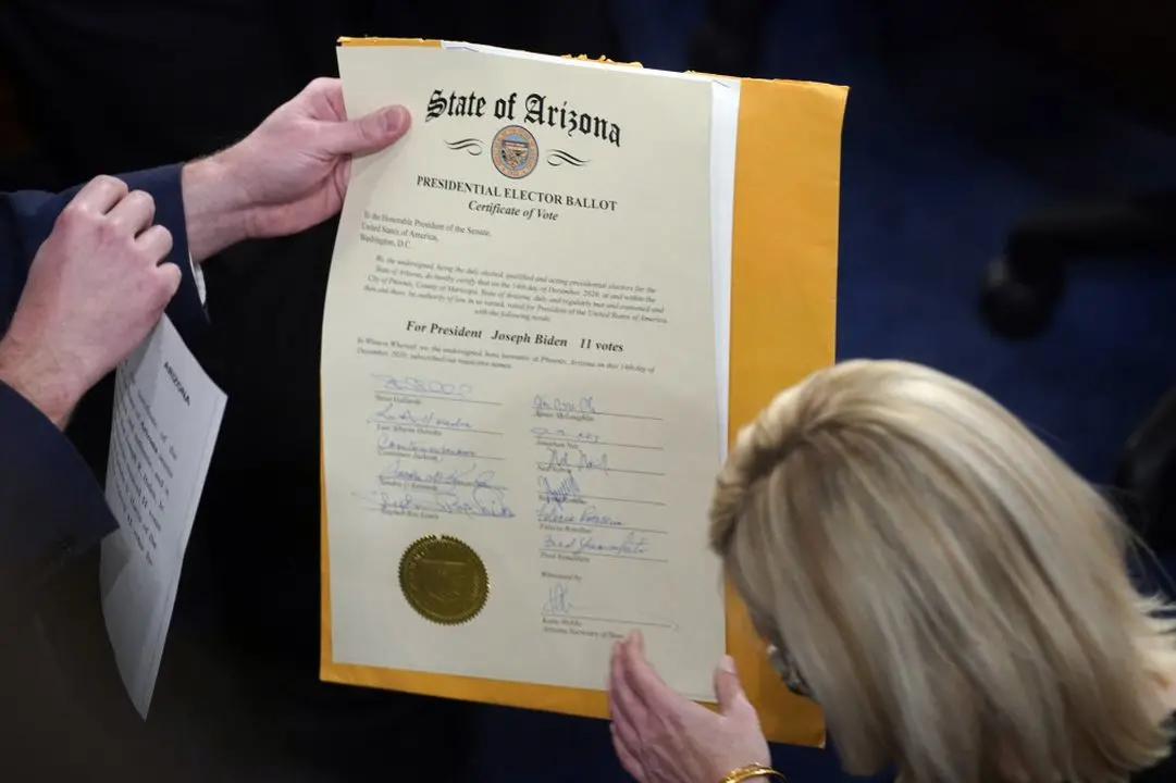 File photo shows the certification of Electoral College votes for the state of Arizona after being unsealed during a joint session of the House and Senate convenes to confirm the electoral votes cast in the 2021 elections.