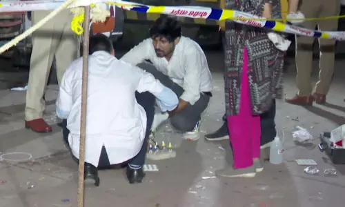 Forensic team investigates at the site where former Maharashtra minister Baba Siddique was shot dead by three assailants, in Mumbai