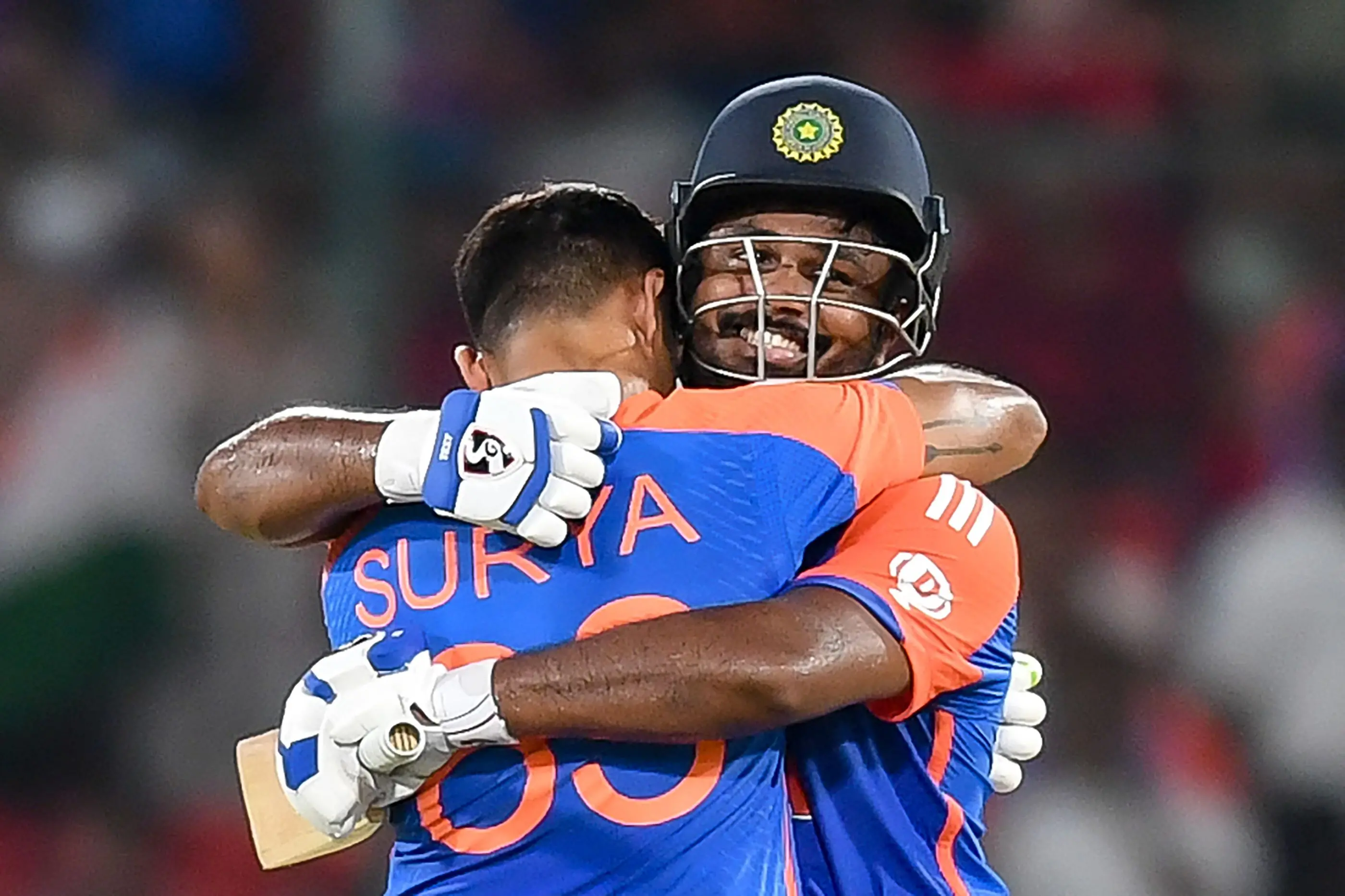 India's Sanju Samson celebrates with captain Suryakumar Yadav after scoring a century during the third and final Twenty20 international cricket match between India and Bangladesh at the Rajiv Gandhi International Stadium in Hyderabad on Saturday | Photo: AFP