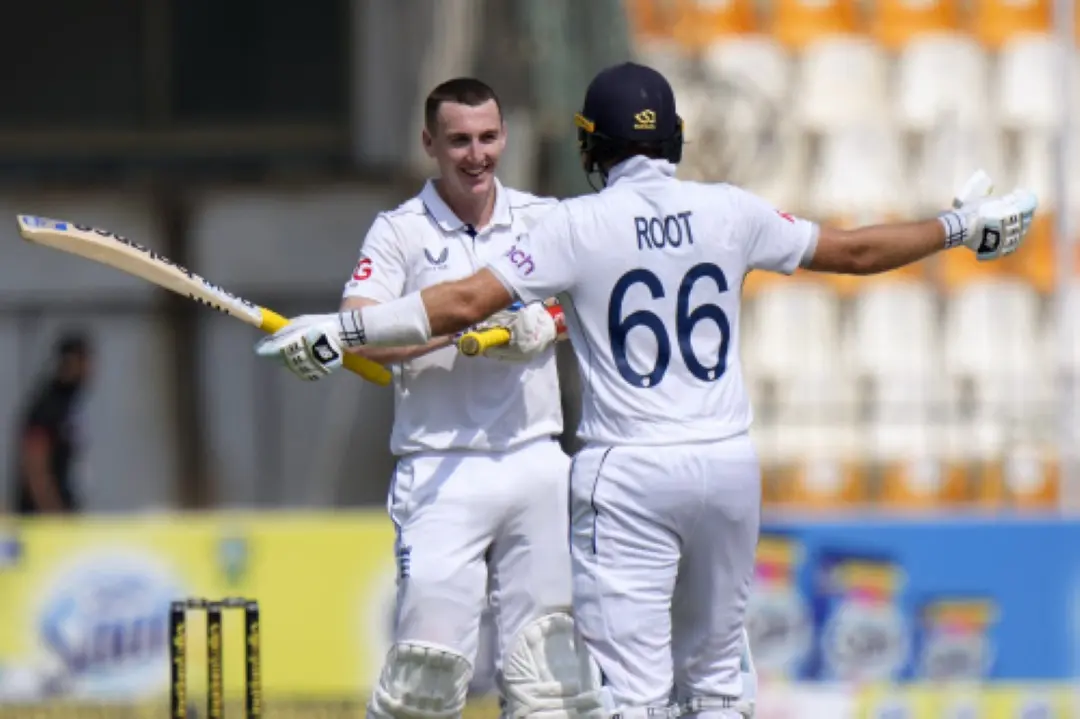 England's Harry Brook, centre, celebrates with Joe Root after scoring double century during the fourth day of the first test cricket match between Pakistan and England, in Multan, Pakistan. | Photo: AP/PTI