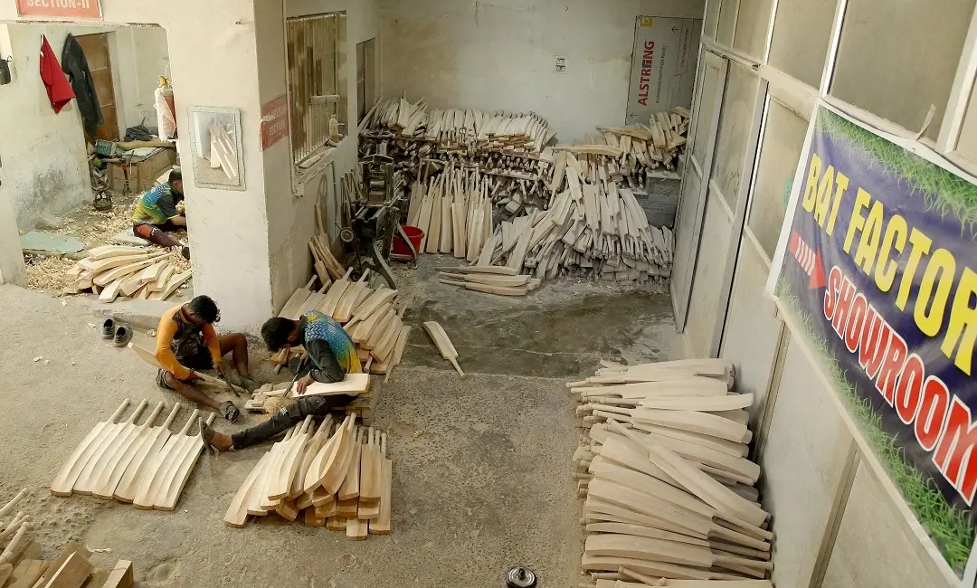 Workers in a cricket bat manufacturing unit work on bats | Photo: PG Unnikrishnan / Mathrubhumi