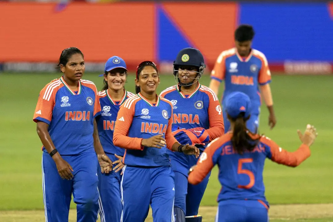 Indian team members celebrate the wicket of New Zealand's Georgia Plimmer during the ICC Women's T20 World Cup 2024 match between India and New Zealand at Dubai International Stadium