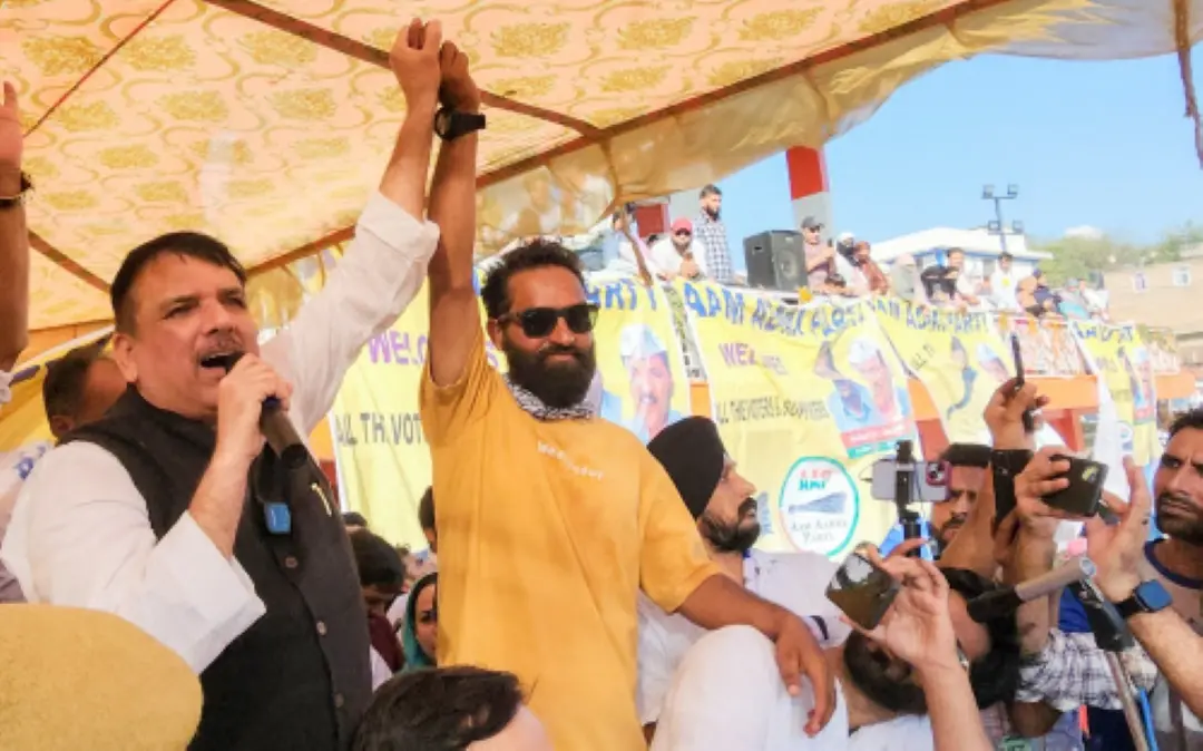 Aam Admi Party (AAP) leader Sanjay Singh with party candidate from Doda Assembly Constituency Mehraj Malik during an election rally. | File Photo: ANI